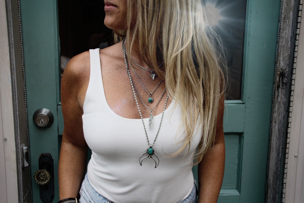 Multi-layered necklace, with antique silver metal and teal details